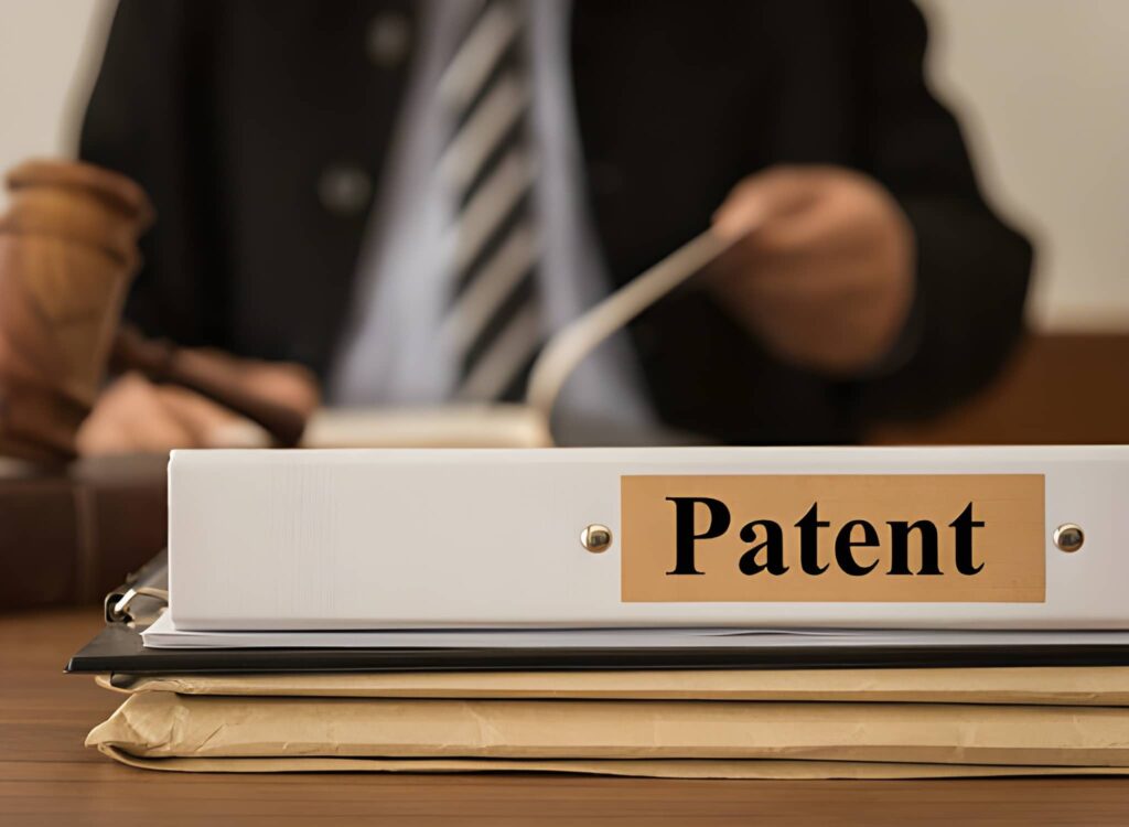 Informational graphic showing a "Patent" folder and legal gavel, with text highlighting 80% fee rebates for Indian startups and MSMEs.