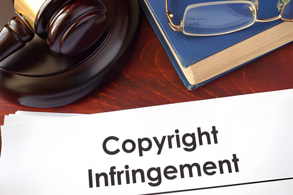 An educational infographic showing a list of copyright infringement examples next to a legal gavel, glasses, and a book.