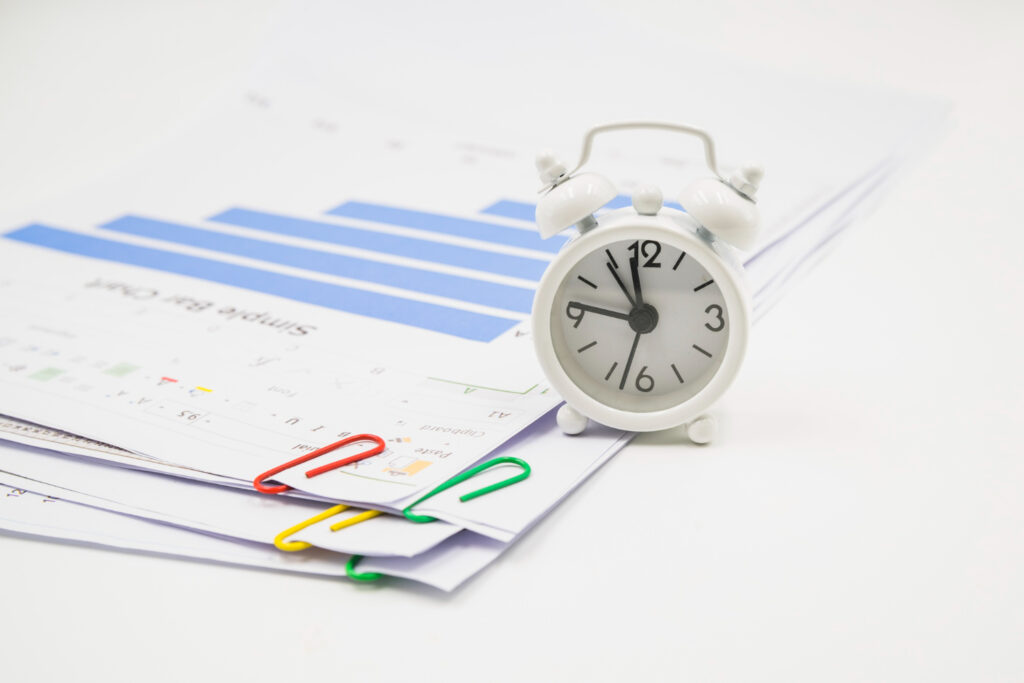 legal documents with colorful paperclips, symbolizing the strict timelines for filing a Request for Examination.